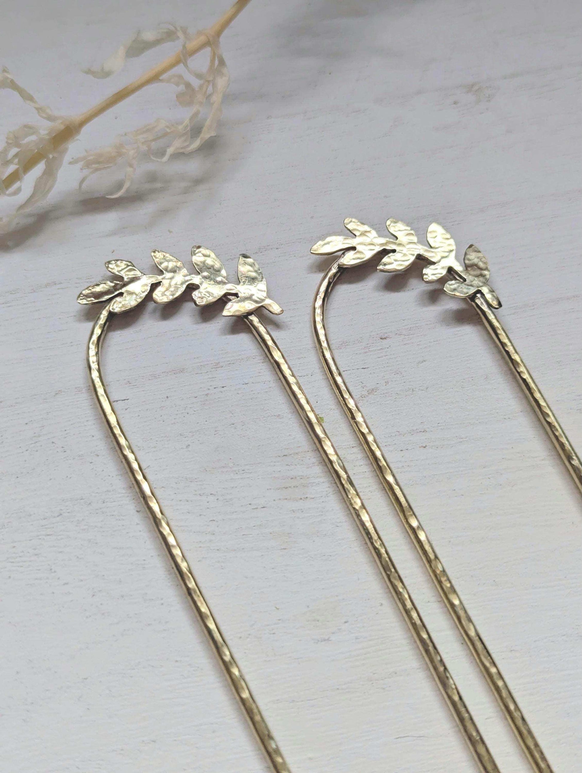 Handcrafted and forged romantic Grecian style laurel leaf rounded hair fork - hammered gold brass laurel leaf is offset to the right at the top of the hair fork