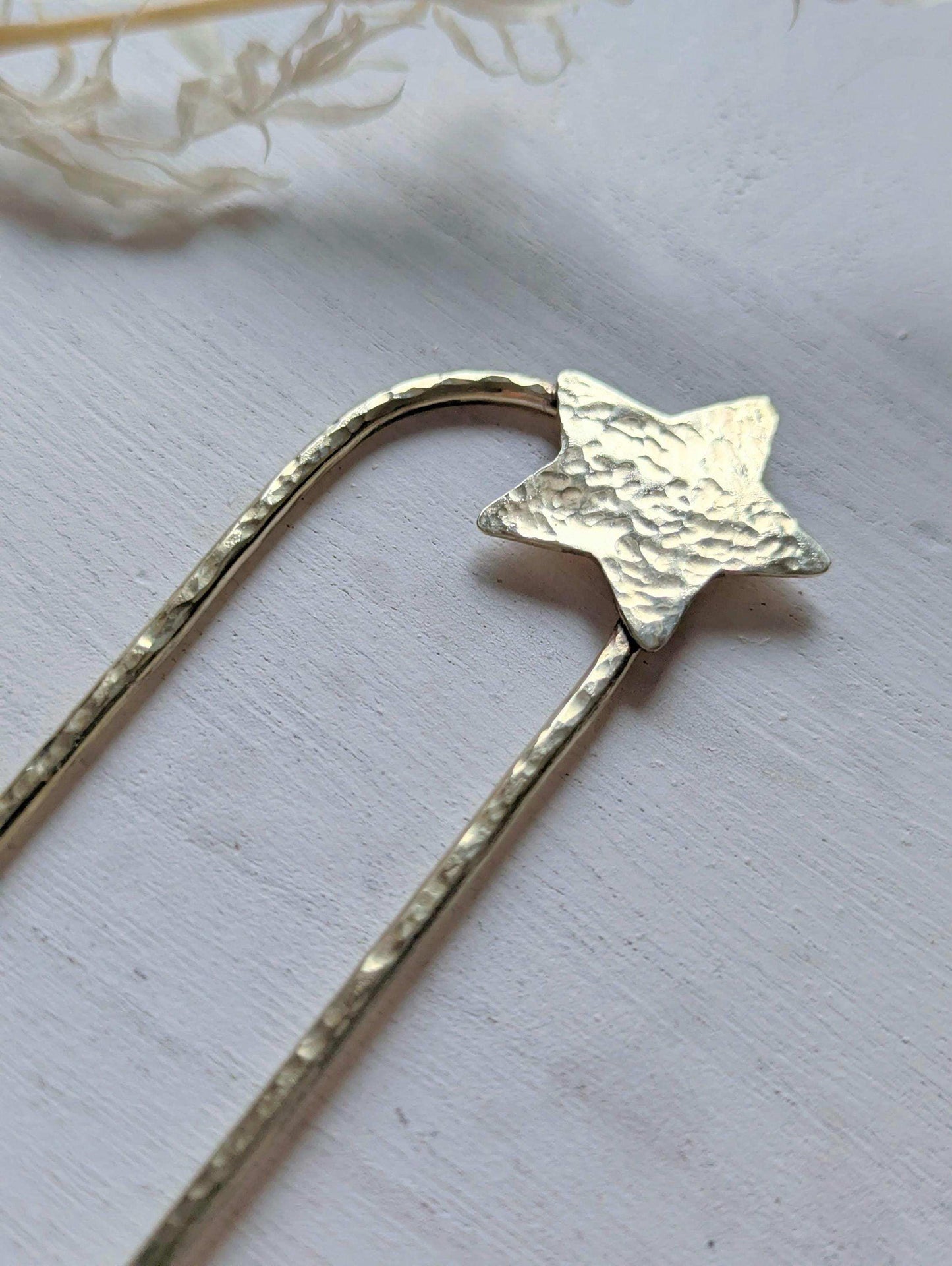 Handcrafted and forged hammered gold star rounded French pin bun hair fork - star offset to the right at the top of the hair fork