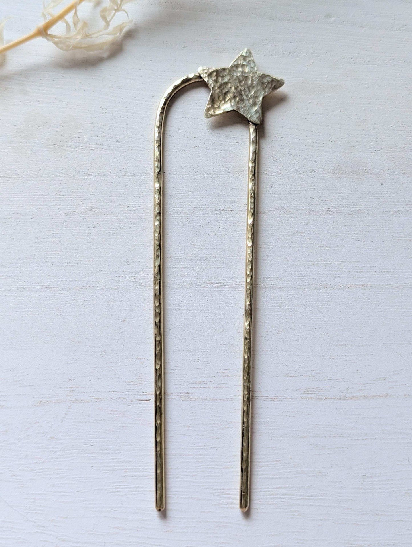 Handcrafted and forged hammered gold star rounded French pin bun hair fork - star offset to the right at the top of the hair fork