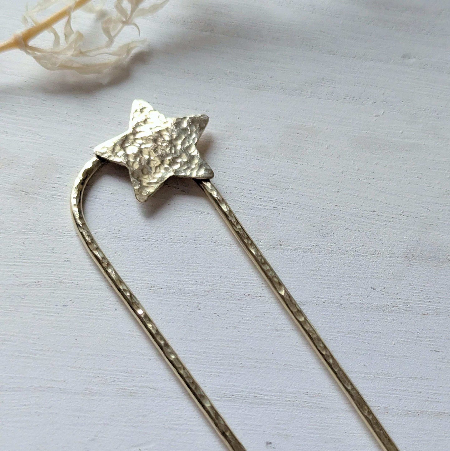 Handcrafted and forged hammered gold star rounded French pin bun hair fork - star offset to the right at the top of the hair fork