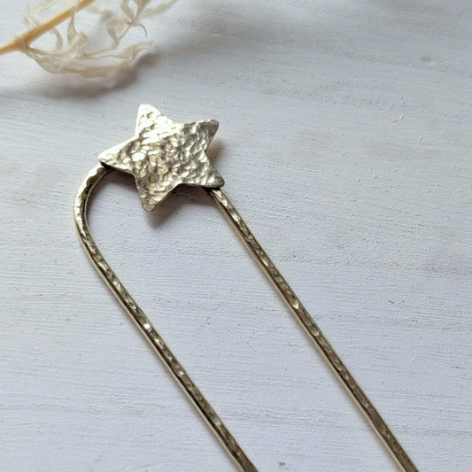 Handcrafted and forged hammered gold star rounded French pin bun hair fork - star offset to the right at the top of the hair fork