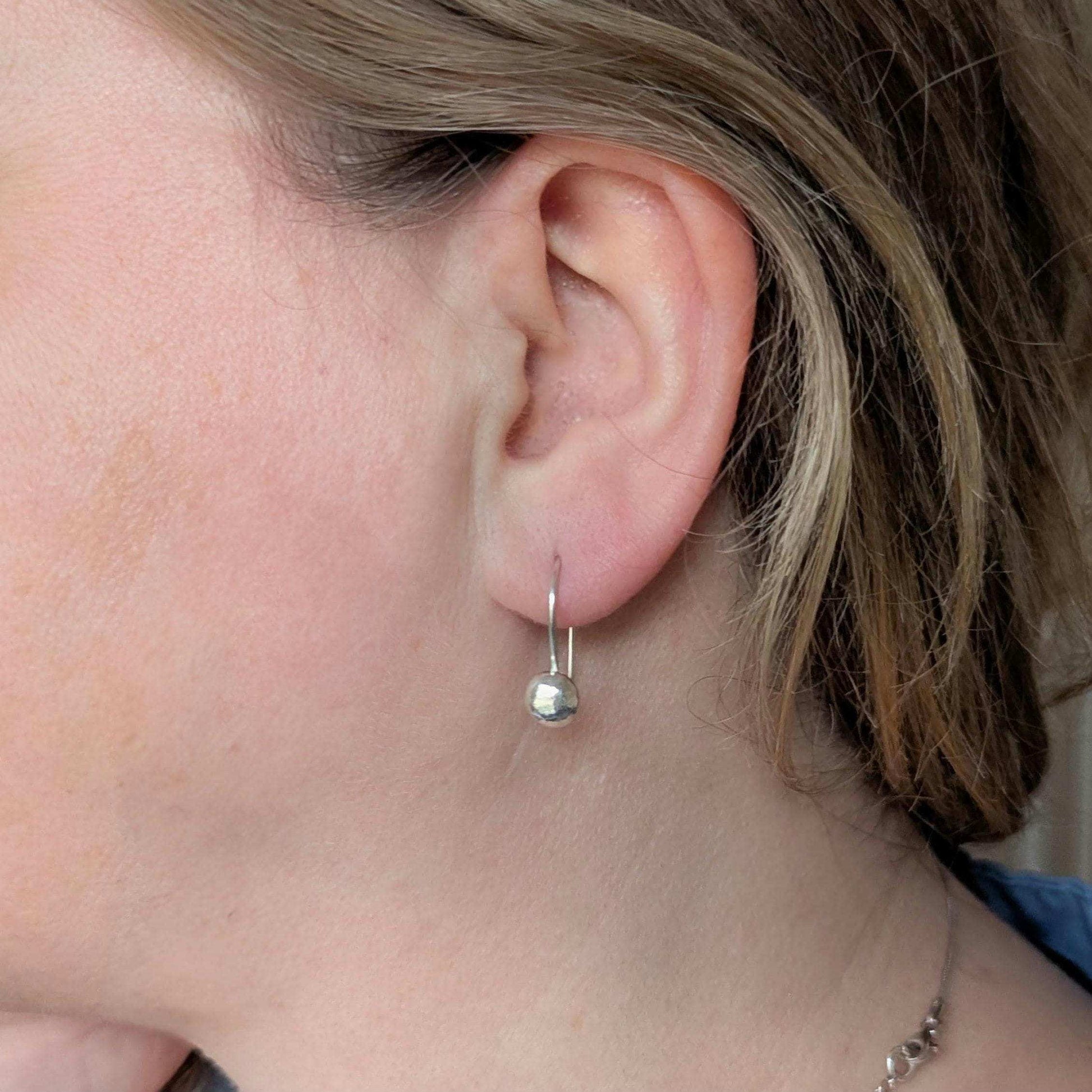 Dainty handcrafted 925 sterling silver pebble drop earrings with a hammered texture