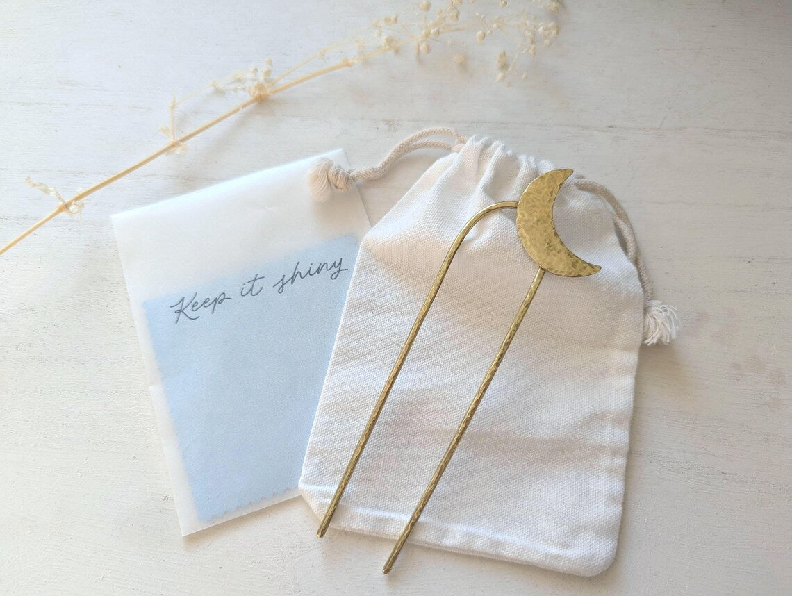 Gold Moon U Pin French bun hair fork - hammered brass moon is offset to the top right of the hair fork - cotton bag and polishing cloths included