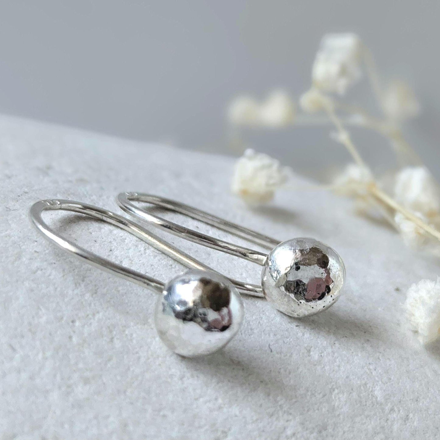 Dainty handcrafted 925 sterling silver pebble drop earrings with a hammered texture