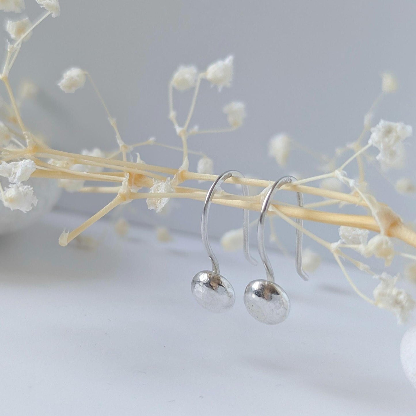 Dainty handcrafted 925 sterling silver pebble drop earrings with a hammered texture
