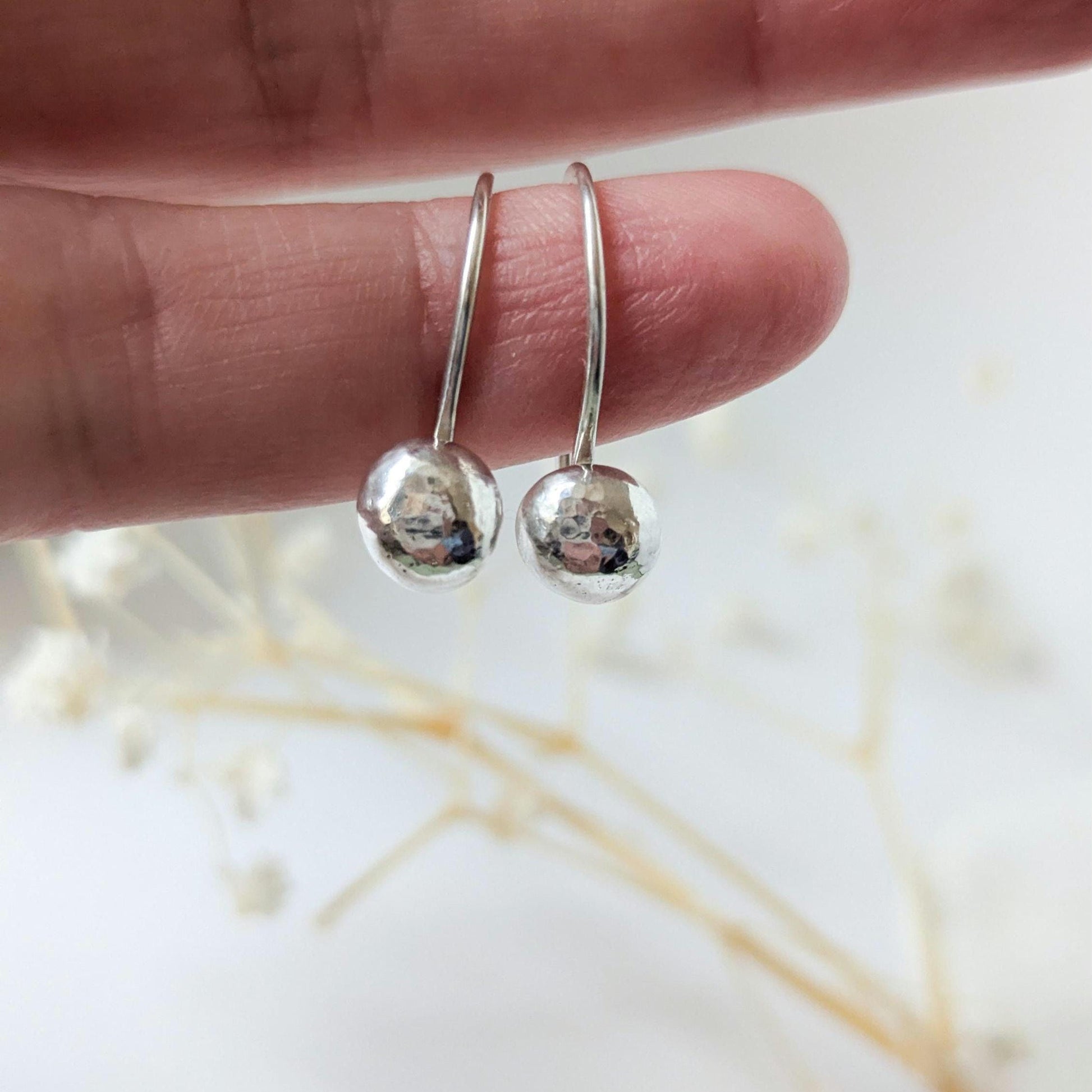 Dainty handcrafted 925 sterling silver pebble drop earrings with a hammered texture