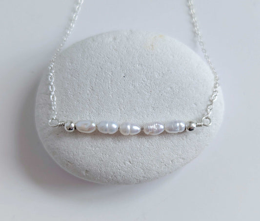 Dainty freshwater seed pearl bar necklace - close up of pearl bar