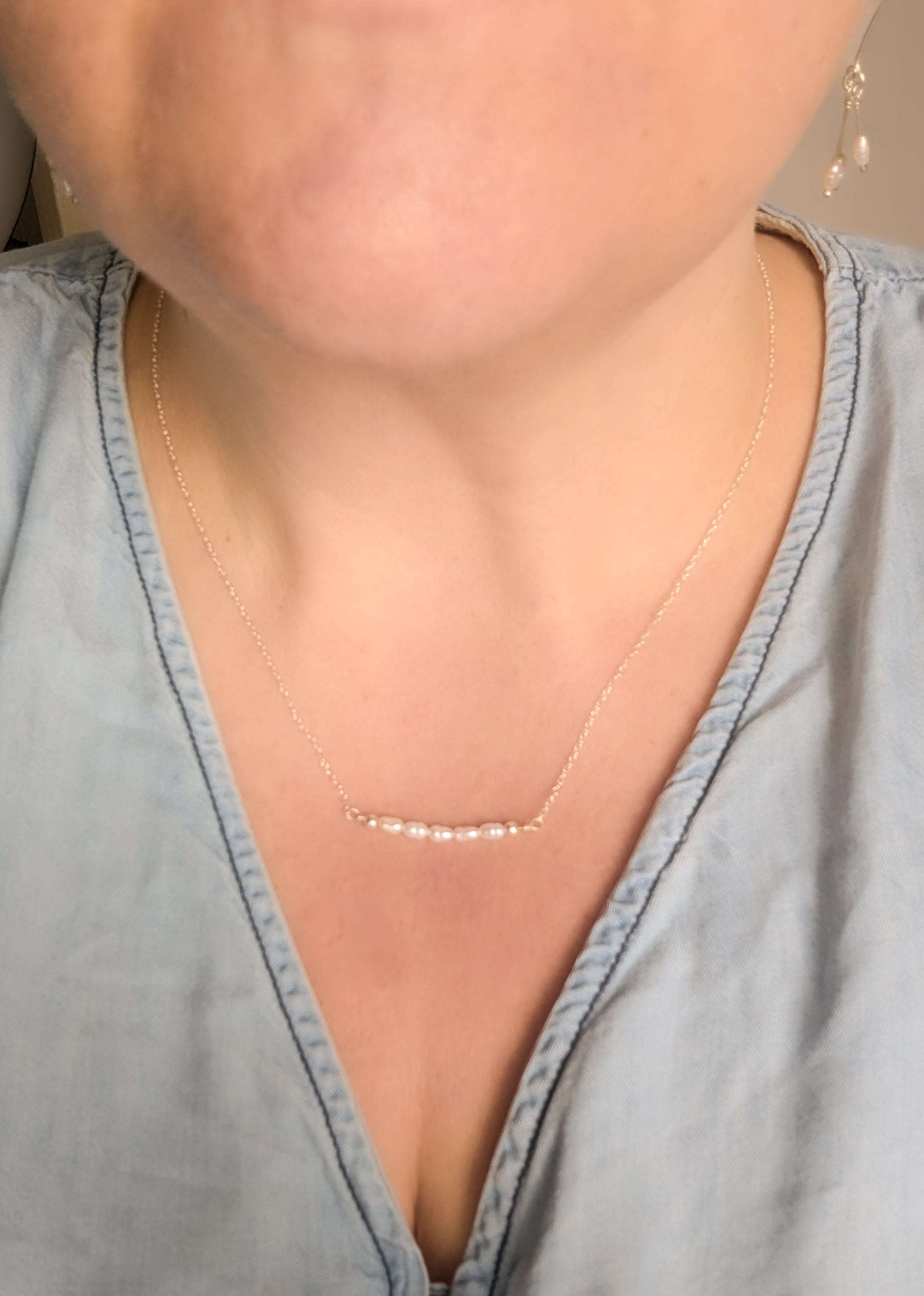 Dainty freshwater seed pearl bar necklace - shown being worn at 18" length