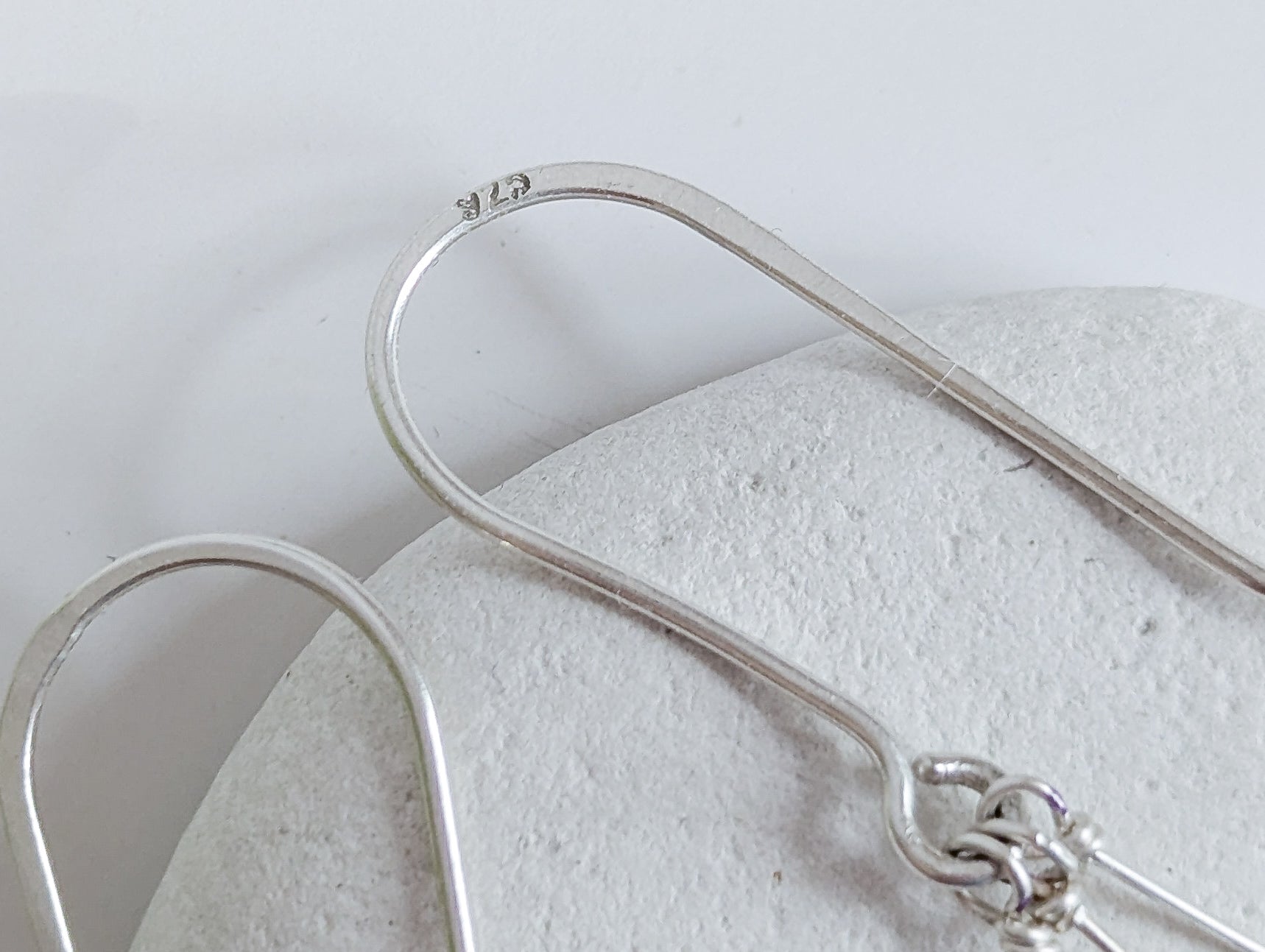 Dainty freshwater seed pearl dangle cascade drop earrings in Sterling silver - close up on 925 stamp on ear wire