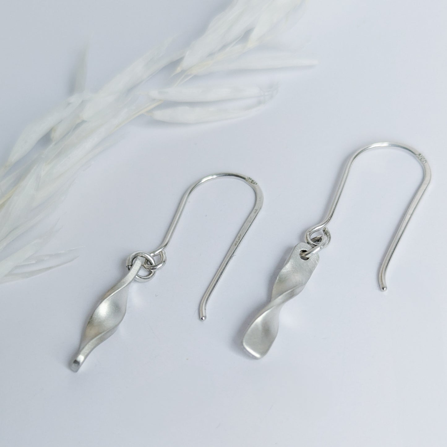 Minimalist satin brushed sterling silver twist drop earrings- side vew
