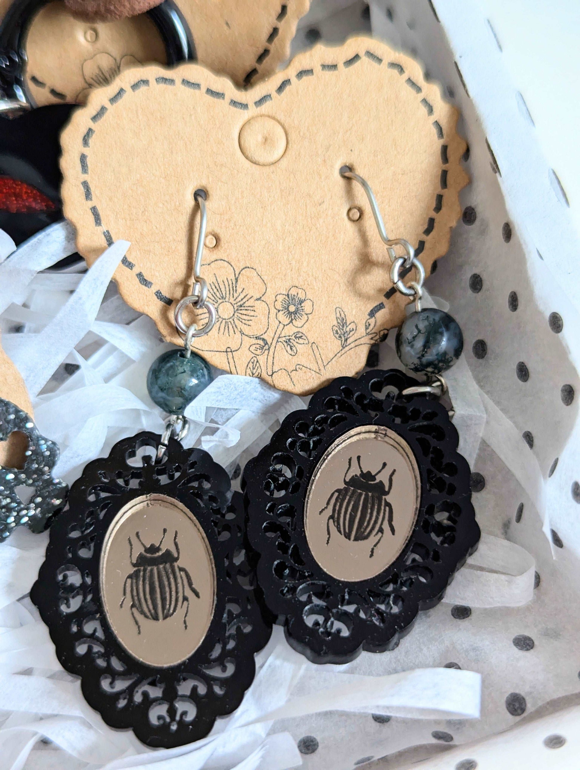 Alternative Moth & Wing themed acrylic jewellery gift box, This set includes; acrylic necklace, dangle earrings, studs and boot heel charm