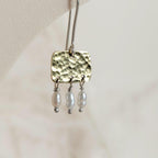 Roman style hammered brass gold squares with 3 seed pearl droplets hanging from each square | 925 Sterling Silver ear wires - mixed metals - close up of hammered texture