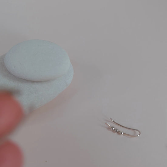 showing hammered texture shining when the ear climbers catch the light