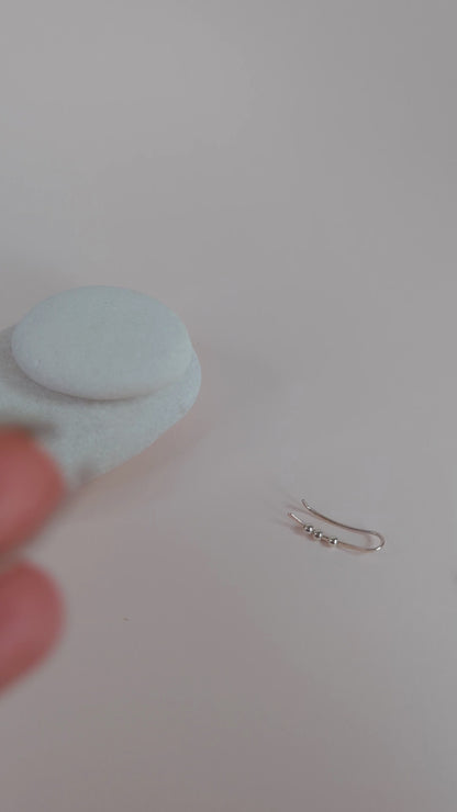 showing hammered texture shining when the ear climbers catch the light