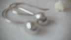 Dainty handcrafted 925 sterling silver pebble drop earrings with a hammered texture