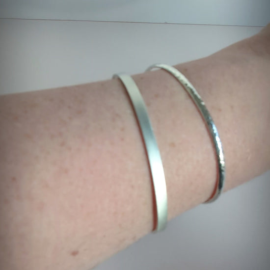 brushed sterling cuff worn on a wrist
