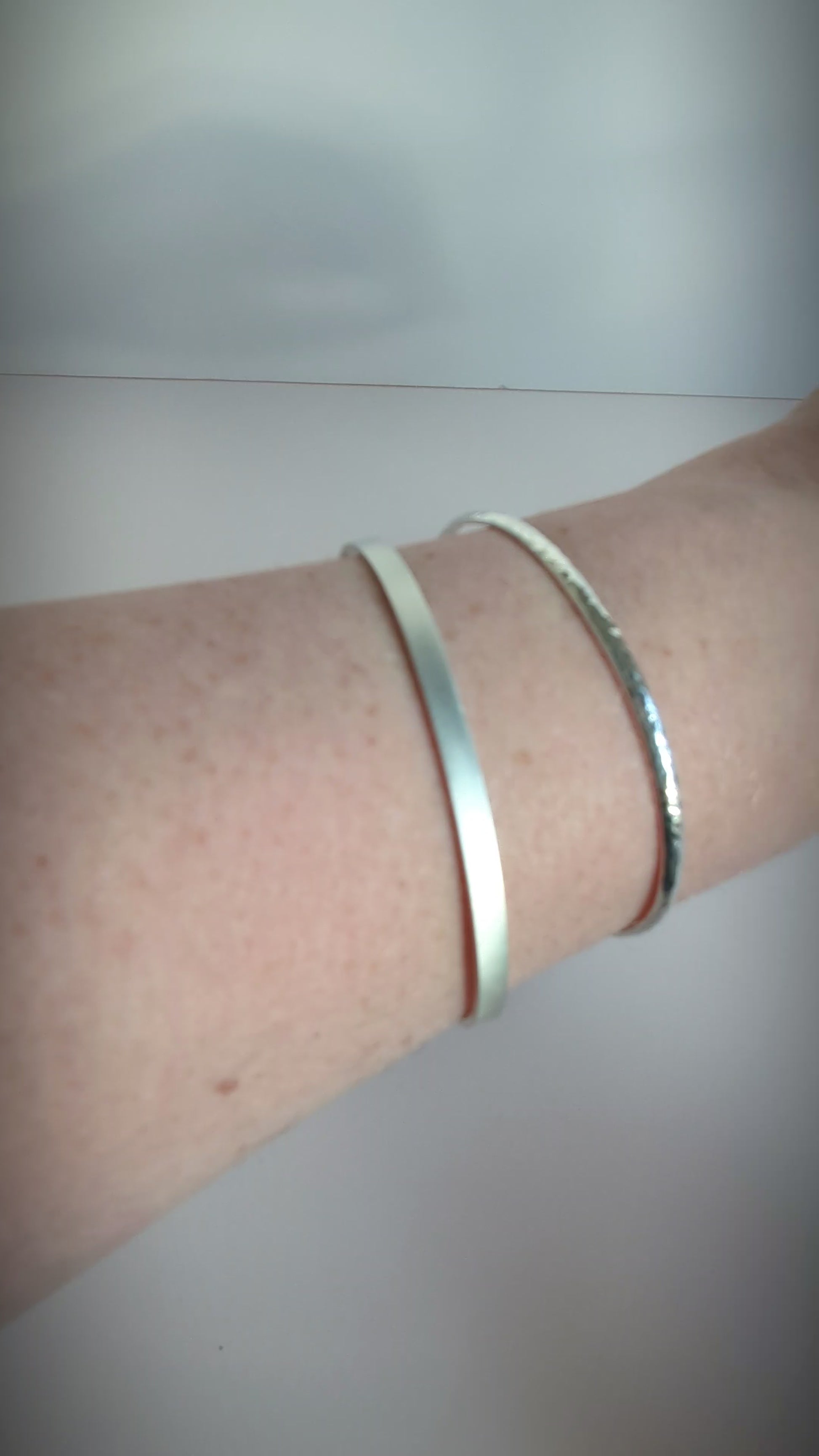 brushed sterling cuff worn on a wrist