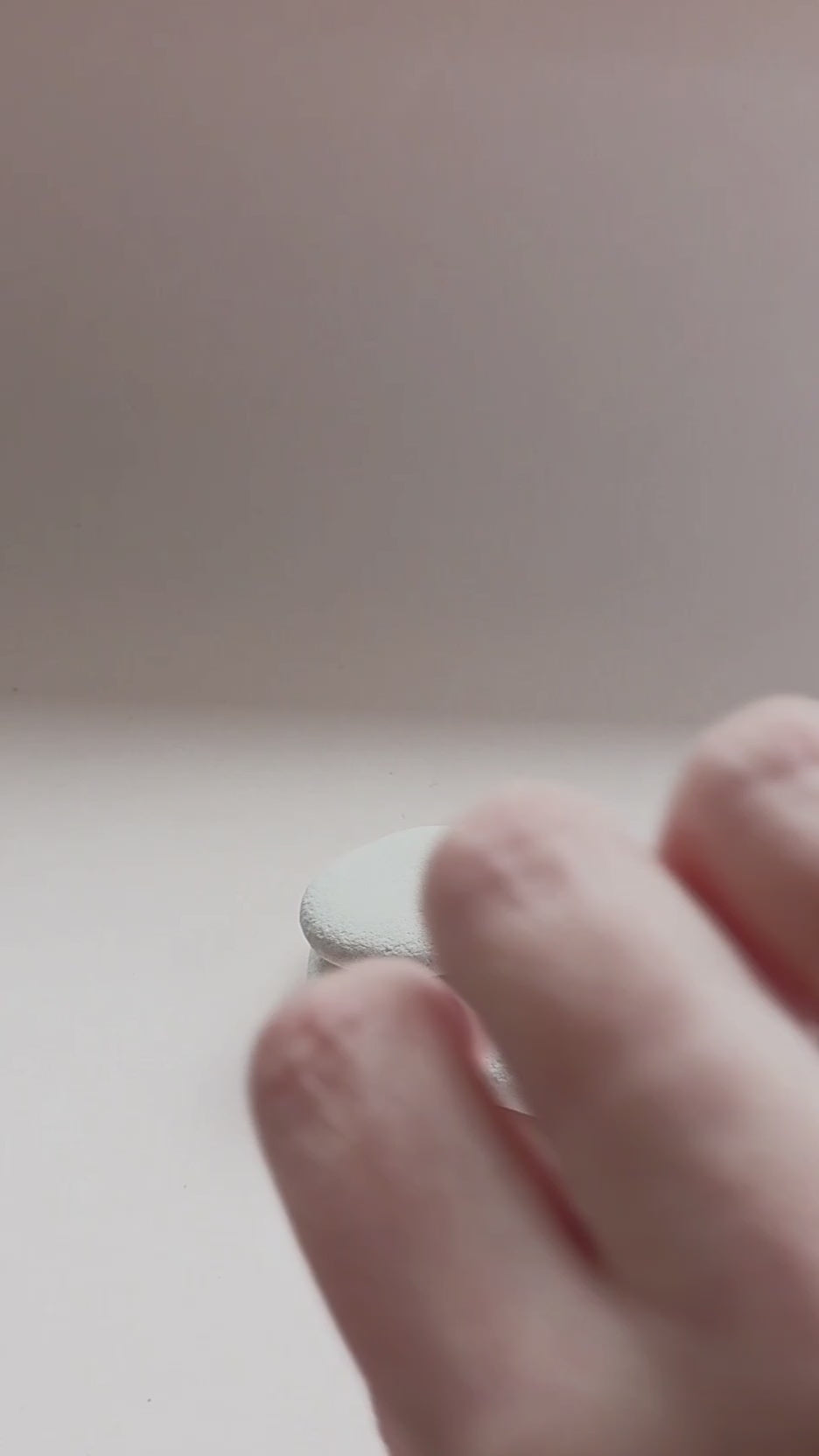 Sterling Silver ring with hand stamped star pattern on a light gray stone surface