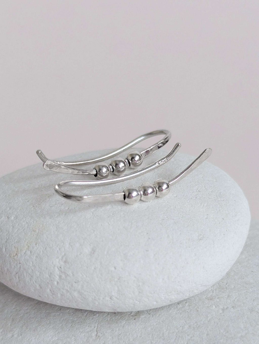 Silver  bead ear climber with beads on a white stone