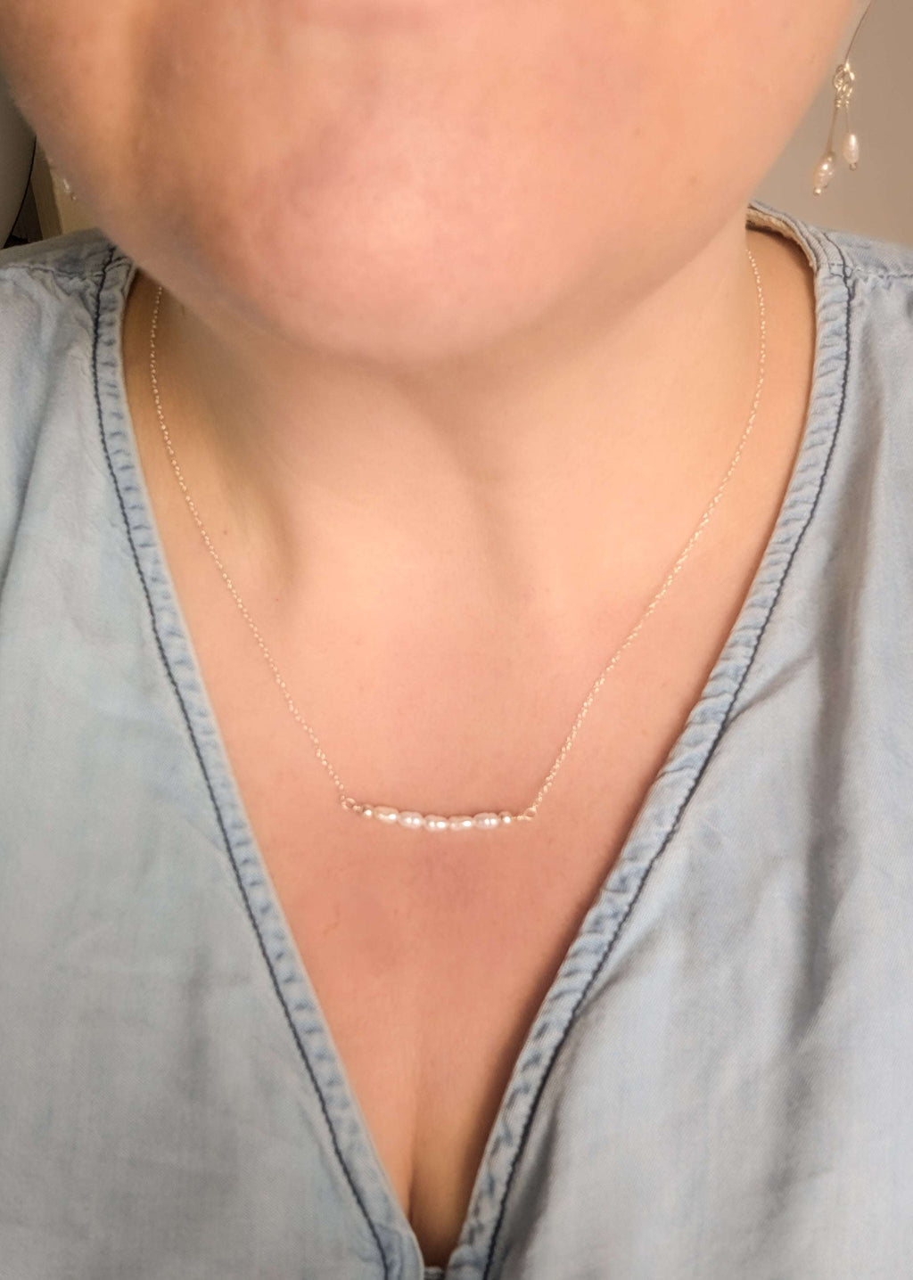 Dainty freshwater seed pearl bar necklace - shown being worn at 18" length