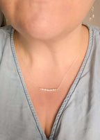 Dainty freshwater seed pearl bar necklace - shown being worn at 18" length