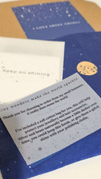 Card with text and a small round object on a blue background