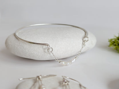 Thin sterling silver dainty cuff bangle with seed pearl bar chain - shows pearl chain detail