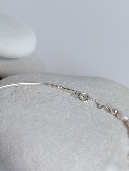 Thin sterling silver dainty cuff bangle with seed pearl bar chain - shows 925 sterling silver stamp on the inside end of cuff
