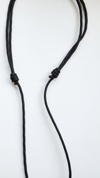 adjustable black cord necklace with a knot on a white background